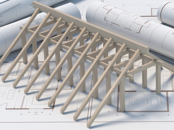 Roofing contractor and engineer office. Wooden framing  trusses, roof beams structure on project blueprint plans background. Roof construction and engineering. 3d illustration